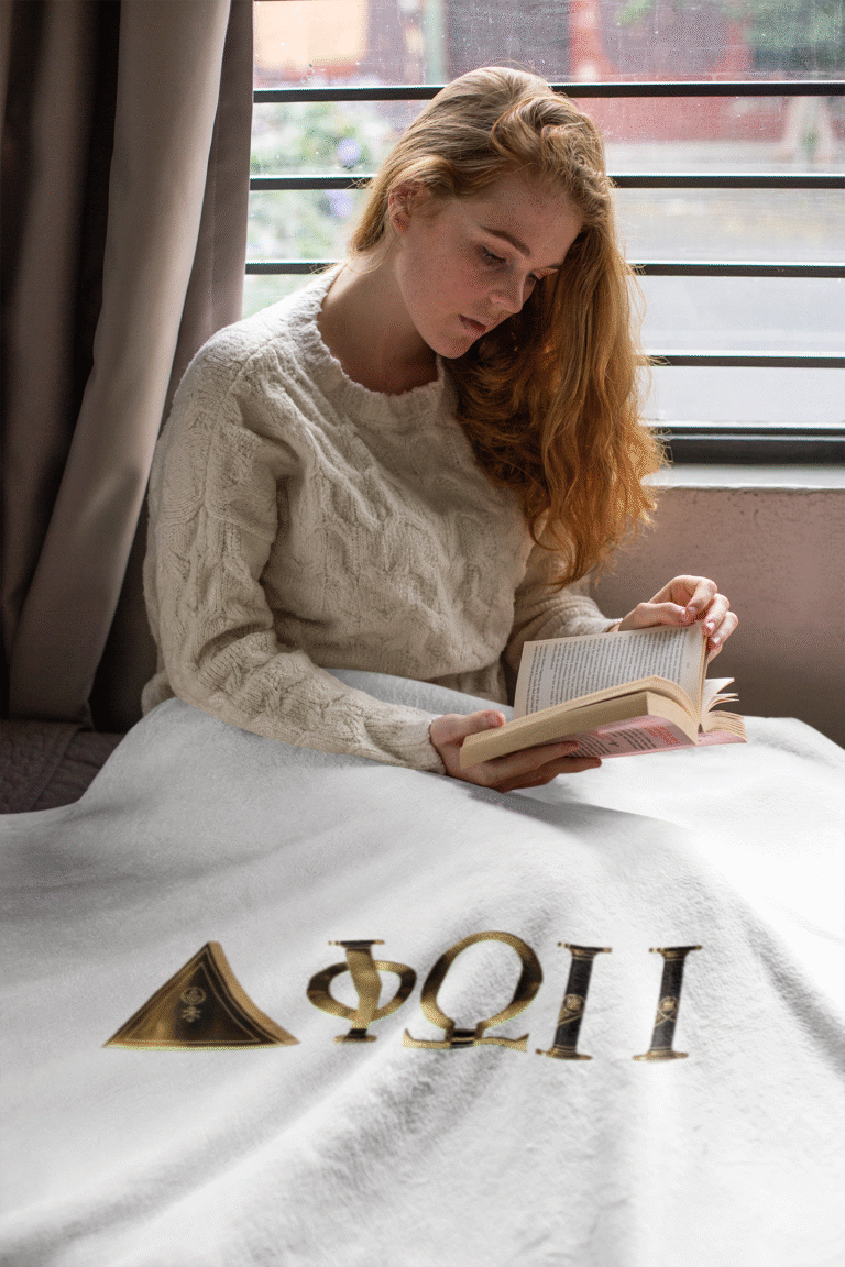 fleece-blanket-mockup-featuring-a-cozy-woman-reading-a-book-24682